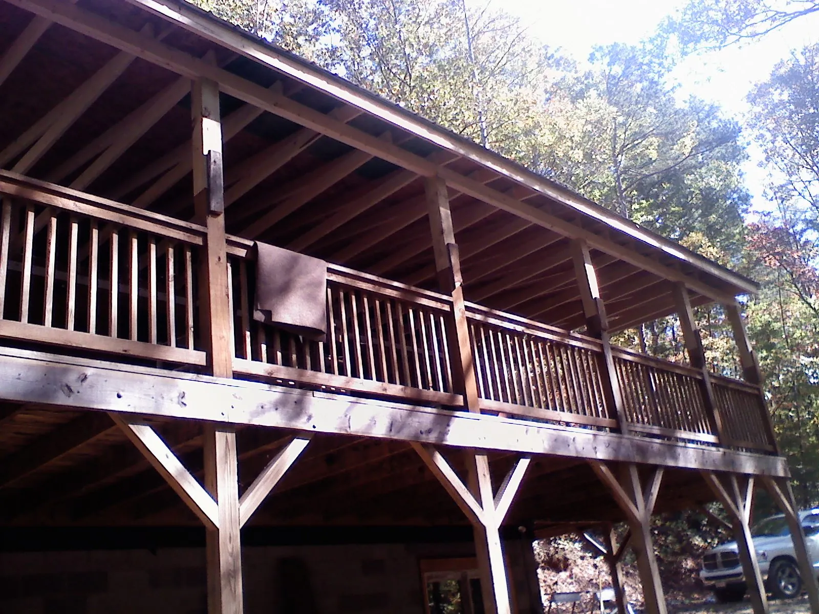 Timber framing under a new elevated porch and deck — Roof Leak Repair in East Andover by Roofing Brothers